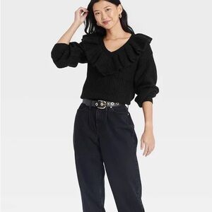 Black V-Neck Sweater with Ribbed Texture and Dramatic Ruffle